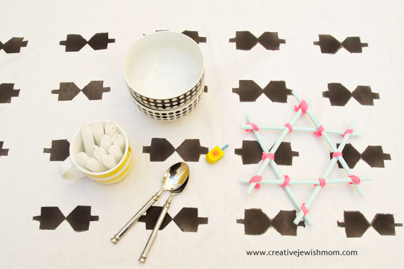 DIY Hanukkah Tablecloth With Block Printed Dreidels